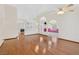 Spacious living room boasts hardwood floors, an arched doorway, and an open floor plan at 114 Tamarack Dr, Henderson, NV 89002