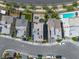 This aerial view shows modern homes with pools, rooftop patios, landscaping, and neighborhood layout at 11695 Gentle Birdsong Ave, Las Vegas, NV 89138