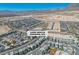 Stunning aerial view of a modern Las Vegas community nestled against a backdrop of mountains and desert landscape at 11695 Gentle Birdsong Ave, Las Vegas, NV 89138