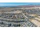 Breathtaking aerial perspective of a well-designed community, nestled within the beauty of the desert landscape and mountain range at 11695 Gentle Birdsong Ave, Las Vegas, NV 89138