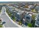 An aerial view of modern homes with rooftop patios, showcasing neighborhood streetscapes and community charm at 11695 Gentle Birdsong Ave, Las Vegas, NV 89138