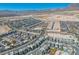 Breathtaking aerial view of a vibrant Las Vegas community with desert mountain views under a clear blue sky at 11695 Gentle Birdsong Ave, Las Vegas, NV 89138