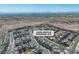 Scenic aerial view of a modern home community, offering a glimpse of suburban living with views of the city skyline at 11695 Gentle Birdsong Ave, Las Vegas, NV 89138
