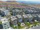 An aerial view highlighting modern homes, community layout, and mountain views, set against the desert landscape at 11695 Gentle Birdsong Ave, Las Vegas, NV 89138