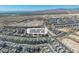 Captivating aerial view of a modern community, highlighting scenic desert surroundings and offering a unique perspective on neighborhood design at 11695 Gentle Birdsong Ave, Las Vegas, NV 89138