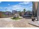 Enclosed backyard with a playhouse and a trampoline set for outdoor fun at 11695 Gentle Birdsong Ave, Las Vegas, NV 89138