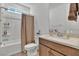 Bathroom featuring tub/shower combo and vanity with storage at 11695 Gentle Birdsong Ave, Las Vegas, NV 89138