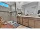 Modern bathroom featuring a glass shower and double sink vanity at 11695 Gentle Birdsong Ave, Las Vegas, NV 89138