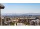 Spectacular city view overlooking modern homes, capturing the essence of urban living with a mountain backdrop at 11695 Gentle Birdsong Ave, Las Vegas, NV 89138