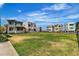 Expansive community lawn surrounded by modern homes, perfect for outdoor activities and community gatherings at 11695 Gentle Birdsong Ave, Las Vegas, NV 89138