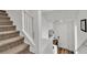 Entryway features carpeted stairs, white walls, and a white front door at 11695 Gentle Birdsong Ave, Las Vegas, NV 89138