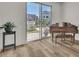 Bright living room with patio access to outdoor area and a grand piano at 11695 Gentle Birdsong Ave, Las Vegas, NV 89138