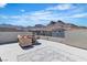 Relaxing rooftop patio with mountain views, outdoor seating, and stylish decor at 11695 Gentle Birdsong Ave, Las Vegas, NV 89138