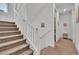 Second story staircase with carpeted steps and white railings at 11695 Gentle Birdsong Ave, Las Vegas, NV 89138