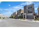 Street view of modern houses with garages and well-kept landscaping at 11695 Gentle Birdsong Ave, Las Vegas, NV 89138