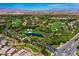 Breathtaking aerial view of the lush golf course community, showcasing beautiful homes and verdant landscape at 11906 Port Labelle Dr, Las Vegas, NV 89141