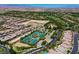 Aerial view features tennis courts surrounded by residential homes in a well-maintained golf community at 11906 Port Labelle Dr, Las Vegas, NV 89141