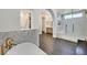 Elegant bathroom with marble accents, a freestanding tub, and a frameless glass shower at 11906 Port Labelle Dr, Las Vegas, NV 89141