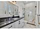 Modern bathroom features marble countertops, a glass-enclosed shower, and sleek black fixtures at 11906 Port Labelle Dr, Las Vegas, NV 89141