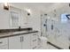 Modern bathroom features a marble shower, stylish vanity with grey countertop, and sleek fixtures at 11906 Port Labelle Dr, Las Vegas, NV 89141