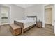 Cozy bedroom with hardwood floors, a plush bed, and rustic furniture, providing a warm and inviting atmosphere at 11906 Port Labelle Dr, Las Vegas, NV 89141