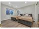Shared bedroom featuring two comfortable beds, soft lighting, and ample space for relaxation at 11906 Port Labelle Dr, Las Vegas, NV 89141
