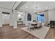 Elegant dining room with modern chandelier, neutral tones, and direct access to the front of the home at 11906 Port Labelle Dr, Las Vegas, NV 89141