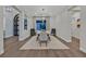 Modern dining area featuring stylish decor, neutral colors, and a smooth transition to the home's entryway at 11906 Port Labelle Dr, Las Vegas, NV 89141