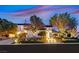Elegant two-story home featuring a beautifully landscaped yard, illuminated stairs, and a warm, inviting ambiance at 11906 Port Labelle Dr, Las Vegas, NV 89141