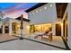 Stylish exterior features a patio, outdoor seating, fire pit, and lush landscaping at 11906 Port Labelle Dr, Las Vegas, NV 89141