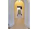 Close-up of the arched front entryway showcasing detailed millwork with a view of the wooden front door at 11906 Port Labelle Dr, Las Vegas, NV 89141