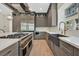 Spacious kitchen with stainless steel appliances, ample cabinetry, a large island, marble countertops, and stylish fixtures at 11906 Port Labelle Dr, Las Vegas, NV 89141