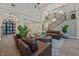 Grand living room with high ceilings, hardwood floors, statement staircase, and refined furnishings at 11906 Port Labelle Dr, Las Vegas, NV 89141