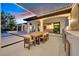 Backyard featuring an outdoor kitchen, dining area, and a luxurious outdoor space at 11906 Port Labelle Dr, Las Vegas, NV 89141