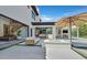 Inviting outdoor living area with a fire pit and patio, seamlessly connected to indoor living spaces at 11906 Port Labelle Dr, Las Vegas, NV 89141