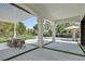 Expansive outdoor patio with dining area and lush backyard views create a relaxing entertaining space at 11906 Port Labelle Dr, Las Vegas, NV 89141