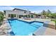 Stunning backyard with a large pool, patio, and lounge area, perfect for outdoor relaxation and entertainment at 11906 Port Labelle Dr, Las Vegas, NV 89141