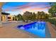 Stunning backyard with a sparkling pool, sun loungers, and a covered patio perfect for outdoor entertaining at 11906 Port Labelle Dr, Las Vegas, NV 89141
