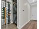 Elegant wine cellar featuring a modern rack and decorative door, enhancing the home's sophistication at 11906 Port Labelle Dr, Las Vegas, NV 89141