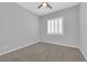 Cozy bedroom features neutral carpet, recessed lighting, and bright plantation shutters at 11909 Pippa Ave, Las Vegas, NV 89138