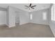 Spacious bedroom with neutral carpet features recessed lighting, and bright windows with plantation shutters at 11909 Pippa Ave, Las Vegas, NV 89138