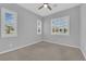 Sunlit bedroom with plantation shutters on the windows and plush carpeting at 11909 Pippa Ave, Las Vegas, NV 89138