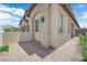 Beautiful home exterior featuring a well-maintained brick walkway, stucco walls, and professionally landscaped greenery at 11909 Pippa Ave, Las Vegas, NV 89138