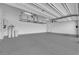 Spacious garage with ample lighting, storage racks, and epoxy sealed floor at 11909 Pippa Ave, Las Vegas, NV 89138