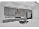 Modern kitchen featuring sleek cabinetry, stainless appliances, and stylish backsplash at 11909 Pippa Ave, Las Vegas, NV 89138