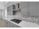 Modern kitchen boasts sleek grey cabinetry and a stylish backsplash at 11909 Pippa Ave, Las Vegas, NV 89138