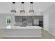 Modern kitchen with stainless appliances, an island with a sink, and pendant lighting at 11909 Pippa Ave, Las Vegas, NV 89138