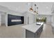 Bright, open kitchen features a large island and custom blue cabinetry at 11909 Pippa Ave, Las Vegas, NV 89138