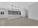 Open-concept kitchen with a large island, stainless appliances, and recessed lighting at 11909 Pippa Ave, Las Vegas, NV 89138