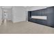 Spacious room with gray walls and custom, dark cabinetry, with a view of the exterior pool at 11909 Pippa Ave, Las Vegas, NV 89138